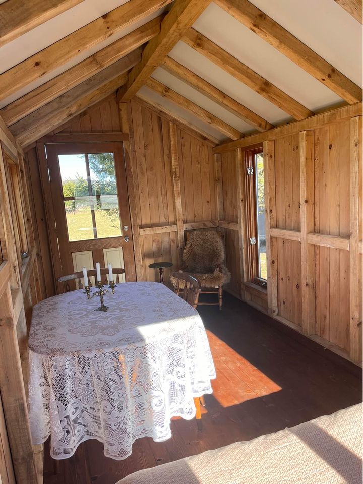 20 x 8 foot mobile home, covered in used wood, steel roof, furnished and comfortable