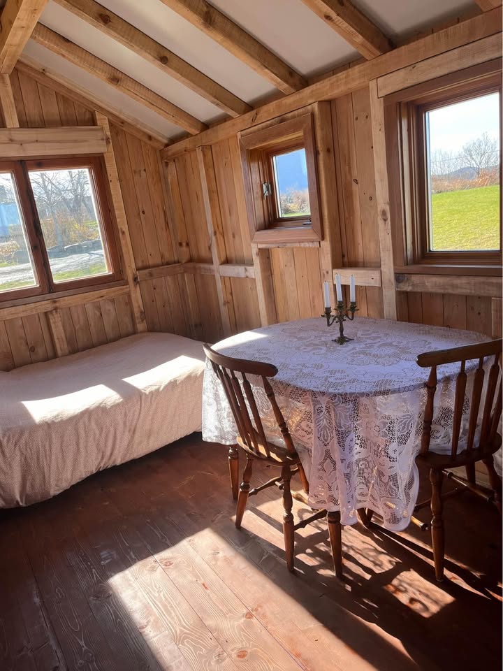 20 x 8 foot mobile home, covered in used wood, steel roof, furnished and comfortable