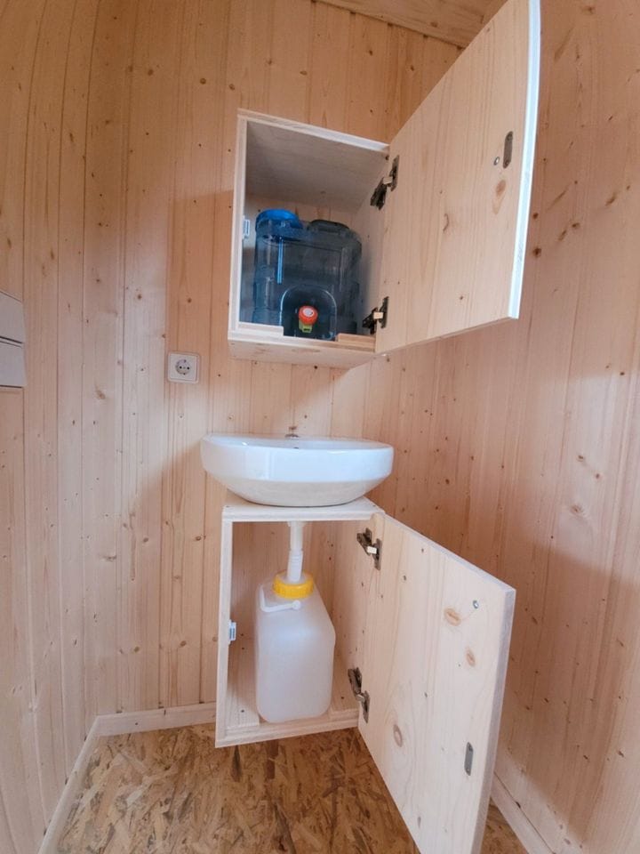 20 foot mobile trailer with door and window covered in wood