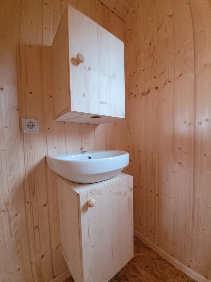 20 foot mobile trailer with door and window covered in wood