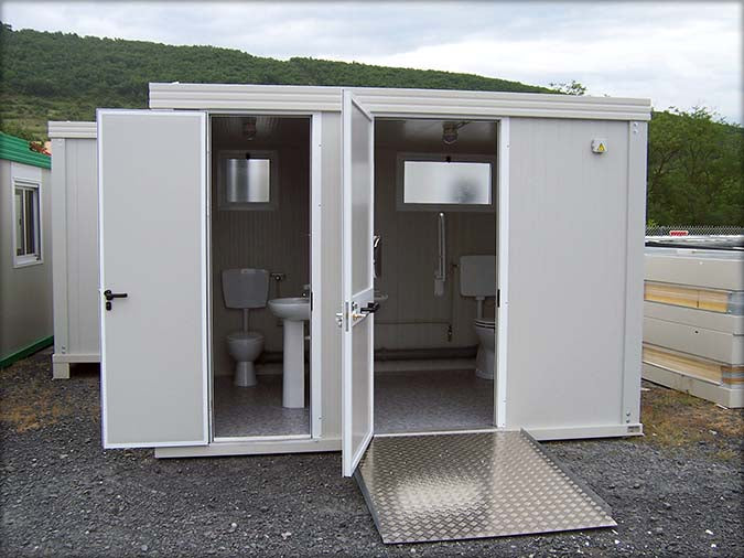 Spacious sanitary cabin with toilet and shower