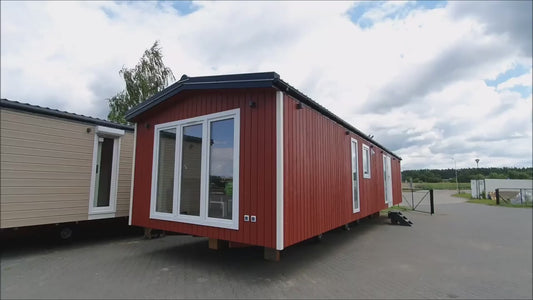 Maison container 40 pieds, lumineuse, meublée, isolée, type T2, finition haut de gamme recouvert en bois rouge